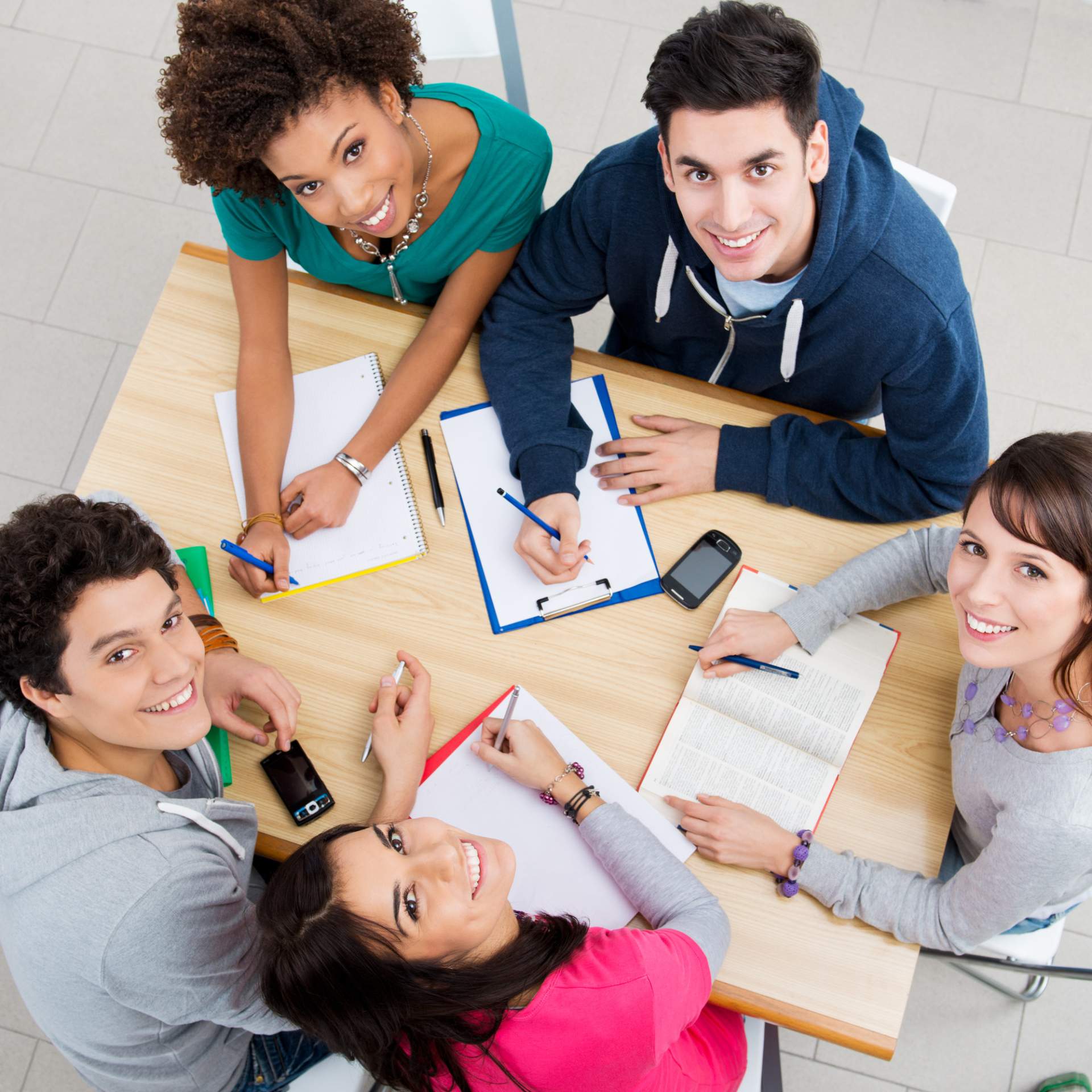 Group of teenagers studying together