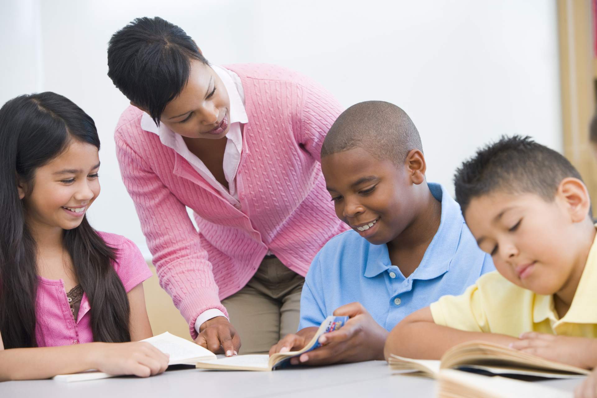 Women teaching children to read